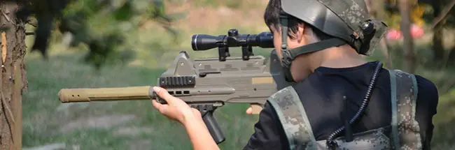 Kid playing outdoor laser tag