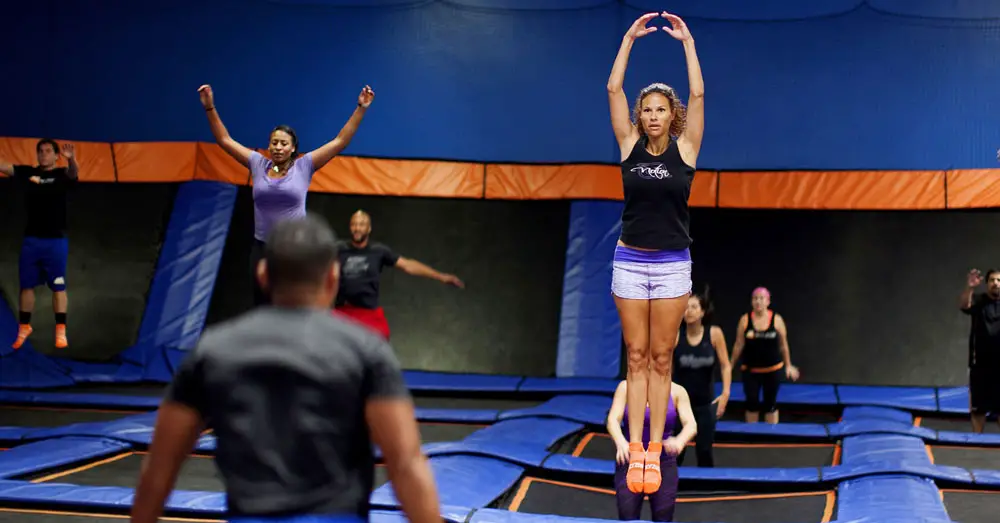 Woman Jumping at a Trampoline Park