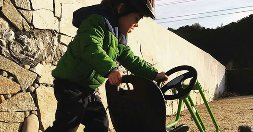 Child with Pedal Go Kart at Sunset